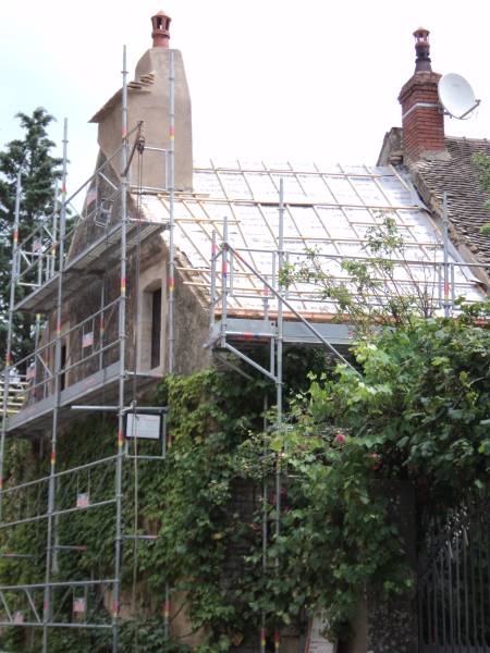 Rénovation d'une couverture en tuiles plates anciennes à Saint-Romain chez un particulier